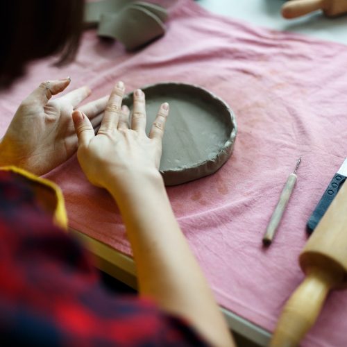 Female Hands Works with Clay Makes Future Ceramic Plate, Classes of Hand Building in Modern Pottery
